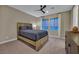 A bedroom featuring a cozy bed, neutral tones, and ample natural light, creates a relaxing and inviting atmosphere at 10 Olympia Outlook Dr, Las Vegas, NV 89141