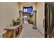 Elegant entryway featuring stone flooring, arched doorways, and a decorative table with stylish accents at 10 Olympia Outlook Dr, Las Vegas, NV 89141