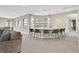 A large game room showcasing a wet bar, seating, and view of the home's interior at 10 Olympia Outlook Dr, Las Vegas, NV 89141