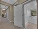 Hallway with an elevator featuring white interiors and modern design at 10 Olympia Outlook Dr, Las Vegas, NV 89141