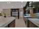 Sleek kitchen featuring hardwood floors, stainless steel appliances, and plenty of counter space at 10 Olympia Outlook Dr, Las Vegas, NV 89141