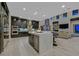 Spacious kitchen featuring an island with barstool seating, modern appliances, and an open layout at 10 Olympia Outlook Dr, Las Vegas, NV 89141