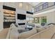 Comfortable living room featuring modern fireplace, stylish furnishings, and access to outdoor space at 10 Olympia Outlook Dr, Las Vegas, NV 89141