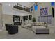 Spacious living room with modern decor, gourmet kitchen, and a second-story loft at 10 Olympia Outlook Dr, Las Vegas, NV 89141