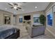 Bright main bedroom with large windows, comfortable seating, and plenty of natural light at 10 Olympia Outlook Dr, Las Vegas, NV 89141