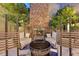 Picturesque outdoor seating with fireplace feature and comfortable seating, perfect for enjoying a cozy evening at 10 Olympia Outlook Dr, Las Vegas, NV 89141