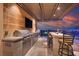 Outdoor kitchen with stainless steel grill, bar seating, and city views at 10 Olympia Outlook Dr, Las Vegas, NV 89141