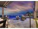 Stunning outdoor patio featuring comfortable seating, a pool, and city views at 10 Olympia Outlook Dr, Las Vegas, NV 89141