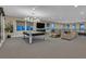 A recreation room showcases a pool table, large TV, and comfortable seating, perfect for relaxation and entertainment at 10 Olympia Outlook Dr, Las Vegas, NV 89141
