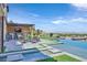 Zero edge swimming pool with integrated spa and water features surrounded by lush landscaping at 10 Olympia Outlook Dr, Las Vegas, NV 89141
