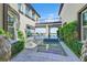 Stunning outdoor water feature with views through the home to the patio and desert landscape at 10 Olympia Outlook Dr, Las Vegas, NV 89141