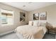 Cozy bedroom featuring modern decor, warm lighting, and a comfortable bed at 10305 Turia Gardens Rd, Las Vegas, NV 89135