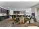 Open-concept living area featuring a gourmet kitchen, breakfast bar, dining area, and comfortable sitting area at 10305 Turia Gardens Rd, Las Vegas, NV 89135
