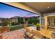 Inviting patio features outdoor seating, lush landscaping, well-kept lawn, and an outdoor sauna at 10305 Turia Gardens Rd, Las Vegas, NV 89135