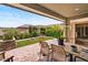 Charming patio featuring a sauna, lush landscaping, outdoor seating, and a lovely stone-paved area at 10305 Turia Gardens Rd, Las Vegas, NV 89135
