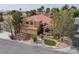 An elevated view shows the property's landscaping, three car garage, and surrounding neighborhood at 10325 Falls Church Ave, Las Vegas, NV 89144