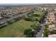 An aerial view overlooking the neighborhood park from a residential district of single-Gathering homes at 10325 Falls Church Ave, Las Vegas, NV 89144