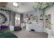 Cozy bedroom with carpeted floors, stylish decor, large window and desk setup at 10325 Falls Church Ave, Las Vegas, NV 89144