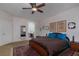 Bedroom featuring carpet floors, closet and an en suite bathroom with marble countertops at 10325 Falls Church Ave, Las Vegas, NV 89144