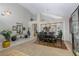 Spacious dining room with high ceilings, neutral colors, and views of the staircase to the second floor at 10325 Falls Church Ave, Las Vegas, NV 89144