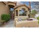 Inviting front porch with seating area, desert landscaping, and a Ring doorbell security system at 10325 Falls Church Ave, Las Vegas, NV 89144