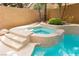 Backyard with pool and hot tub featuring tile trim and easy access from the patio at 10325 Falls Church Ave, Las Vegas, NV 89144