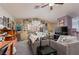Spacious living room featuring neutral colors, bright window, and modern furnishings with movie-themed decorations at 10325 Falls Church Ave, Las Vegas, NV 89144
