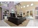Bright living room with tile floors, vaulted ceilings, custom bookshelves and access to the outdoor pool area at 10325 Falls Church Ave, Las Vegas, NV 89144