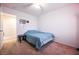 Bedroom with neutral carpet, ceiling fan, and queen sized bed at 1035 Spotted Saddle St, Henderson, NV 89015