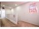 Upstairs hallway with carpet flooring, white railings, and recessed lighting, offering a bright and airy feel at 1035 Spotted Saddle St, Henderson, NV 89015