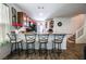 Bright kitchen with granite countertops, stainless steel appliances, and four modern bar stools at 1035 Spotted Saddle St, Henderson, NV 89015