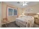 Bright bedroom featuring a bed, windows, and nightstands at 1066 Vanlier Ln, Henderson, NV 89015