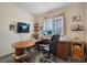 Bedroom with a desk, chair, and window at 1066 Vanlier Ln, Henderson, NV 89015