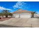 Charming single story home with a tile roof, mature palm tree and a two car garage at 1066 Vanlier Ln, Henderson, NV 89015