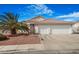 Charming single story home with a tile roof, mature palm tree and a two car garage at 1066 Vanlier Ln, Henderson, NV 89015