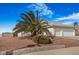 Charming single story home with a tile roof, mature palm tree and a two car garage at 1066 Vanlier Ln, Henderson, NV 89015
