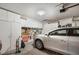 Spacious garage equipped with ample storage, tools and white car at 1066 Vanlier Ln, Henderson, NV 89015