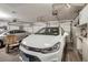 Organized garage with cars, rolling doors and storage solutions at 1066 Vanlier Ln, Henderson, NV 89015