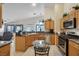 Bright kitchen offers a breakfast nook, modern appliances, and granite countertops at 1066 Vanlier Ln, Henderson, NV 89015