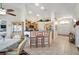 Open kitchen features a breakfast bar and a cozy dining area with natural light at 1066 Vanlier Ln, Henderson, NV 89015