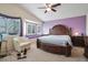 Spacious main bedroom with a vaulted ceiling, bay windows and ensuite bath at 1066 Vanlier Ln, Henderson, NV 89015