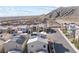 An aerial view of this desirable neighborhood shows modern houses, solar panels, and views of the mountain landscape at 10830 Space Odyssey Ave, Las Vegas, NV 89129