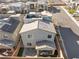 Aerial view of a two-story home with a rooftop deck and landscaped backyard at 10830 Space Odyssey Ave, Las Vegas, NV 89129
