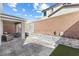 Relaxing backyard with a covered patio and custom water feature for a serene outdoor living at 10830 Space Odyssey Ave, Las Vegas, NV 89129