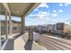 Balcony view showcasing neighborhood street and modern home exteriors under a blue sky at 10830 Space Odyssey Ave, Las Vegas, NV 89129