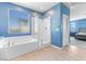Bright bathroom featuring bathtub, shower, and tile flooring at 10830 Space Odyssey Ave, Las Vegas, NV 89129