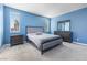 Spacious bedroom with carpet, large windows, and contemporary decor at 10830 Space Odyssey Ave, Las Vegas, NV 89129