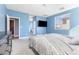 Stylish bedroom with neutral carpet and TV at 10830 Space Odyssey Ave, Las Vegas, NV 89129