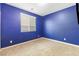 A simple bedroom with a window and blue walls at 10830 Space Odyssey Ave, Las Vegas, NV 89129