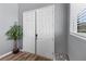 Bright foyer featuring a double door entry, wood floors, and a window at 10830 Space Odyssey Ave, Las Vegas, NV 89129